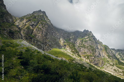 Beautiful view of rocky mountains near the Morskie Oko lake, High Tatras, Zakopane, Poland. Foggy day