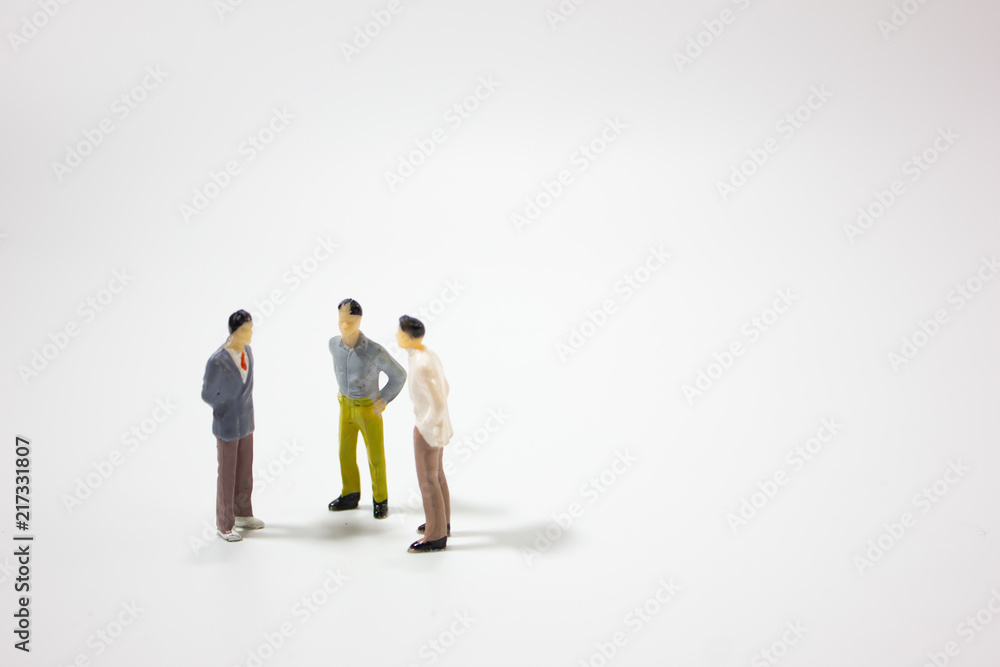 three miniature businessman isolated white background. three miniature businessman isolated white background.