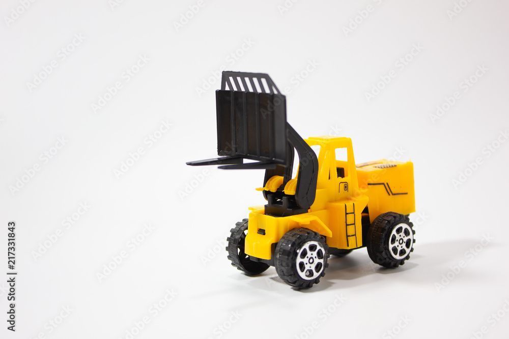 Miniature forklift isolated white background.