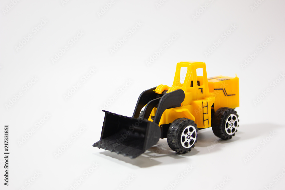 Miniature bulldozer isolated white background. Miniature bulldozer isolated white background.