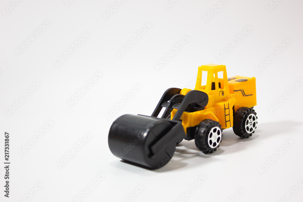 Miniature road roller isolated white background. Miniature road roller isolated white background.
