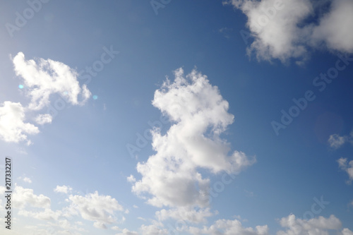 White clouds on a blue sky on a sunny day