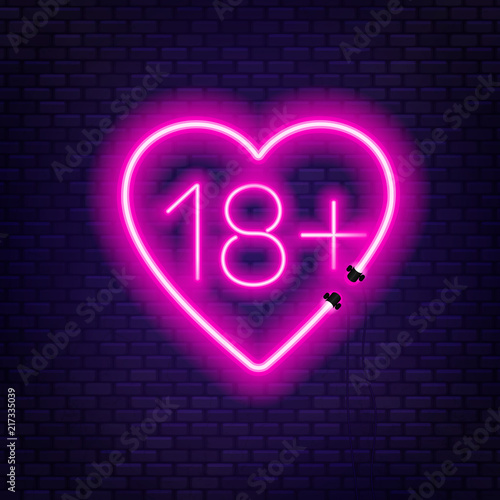 Eighteen plus neon sign on brick wall background.