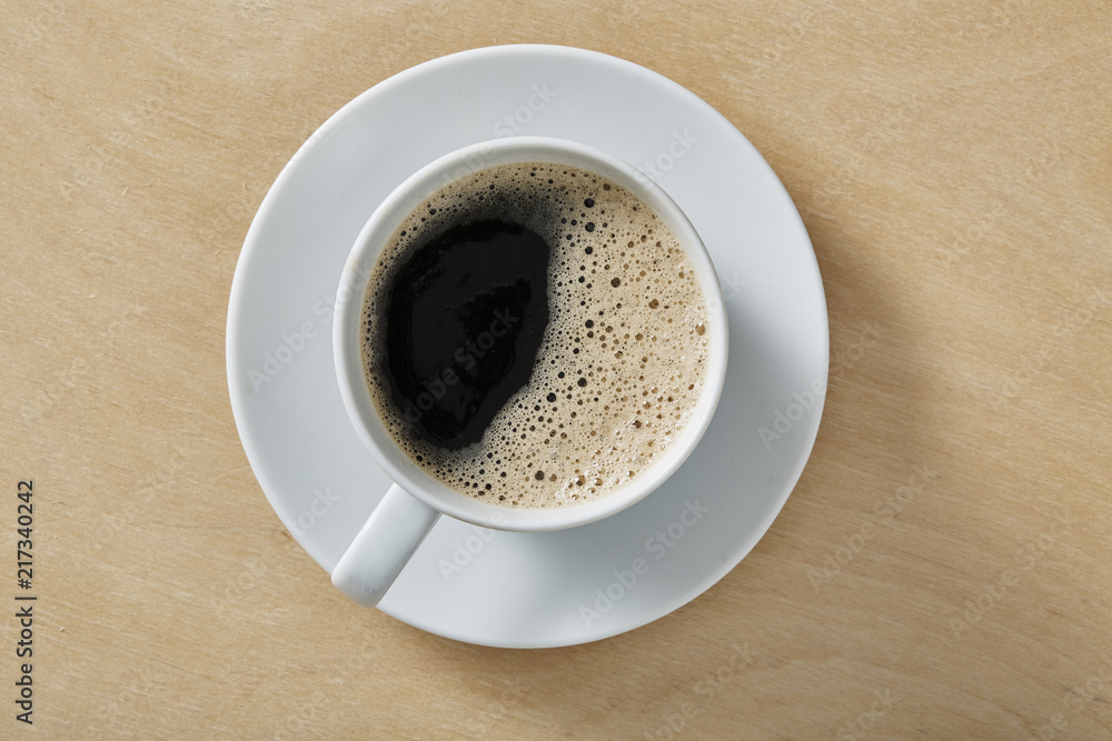 Cup of coffee on wooden table with copy space. Top view. Cup of coffee on wooden table with copy space. Top view.