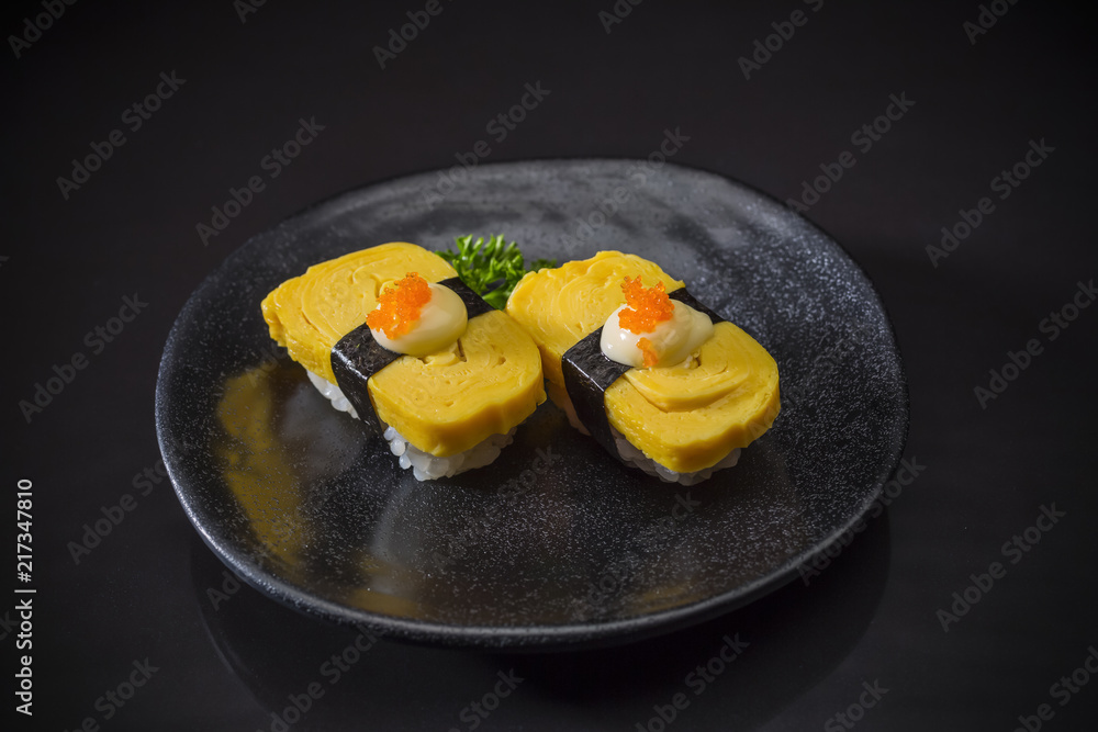 Tamako Nigiri, Tamago Sushi nigiri served on traditional Japanese food
