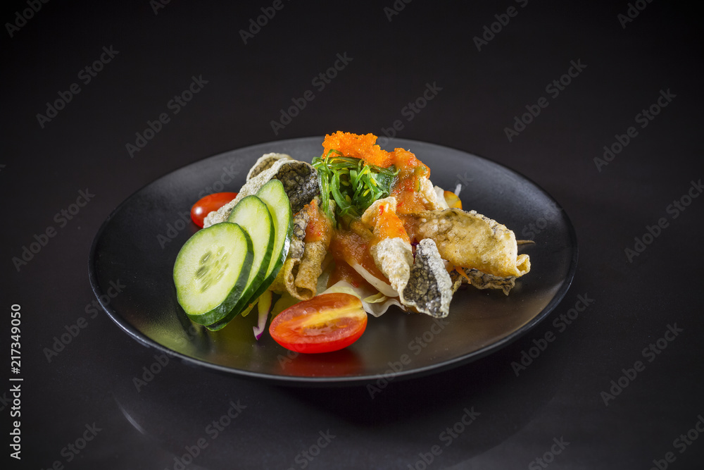 Crispy Salmon Salad topped with wakame and Shrimp Eggs, Japanese food, fuision food, Salmon salad in Thai style, selective focus Crispy Salmon Salad topped with wakame and Shrimp Eggs, Japanese food, fuision food, Salmon salad in Thai style, selective focus