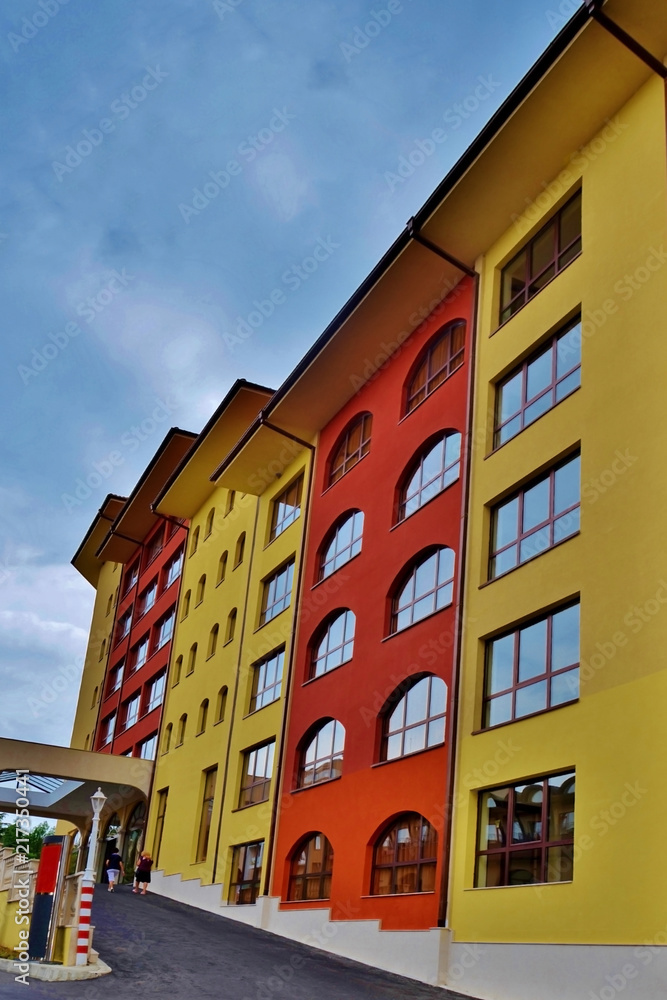 multi-colored stepped hotel, view from below. photo from street to hotel in Bulgaria