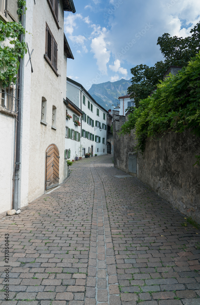 picturesque street in an old alpine village in the Swiss Alps