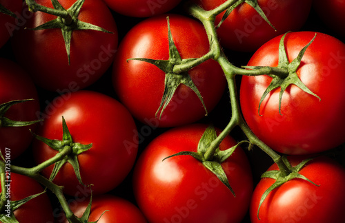 Closeup ripe juicy tomatoes on the vine