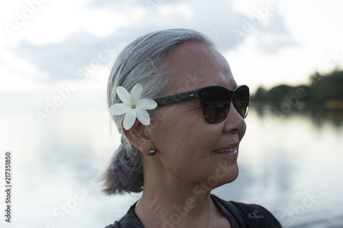 Woman with plumeria in her hair
