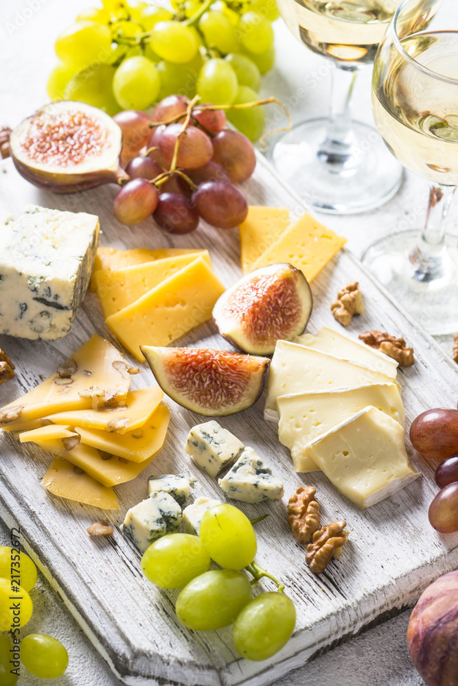 Cheese plate with grapes, figs and nuts. Cheese plate with grapes, figs and nuts.
