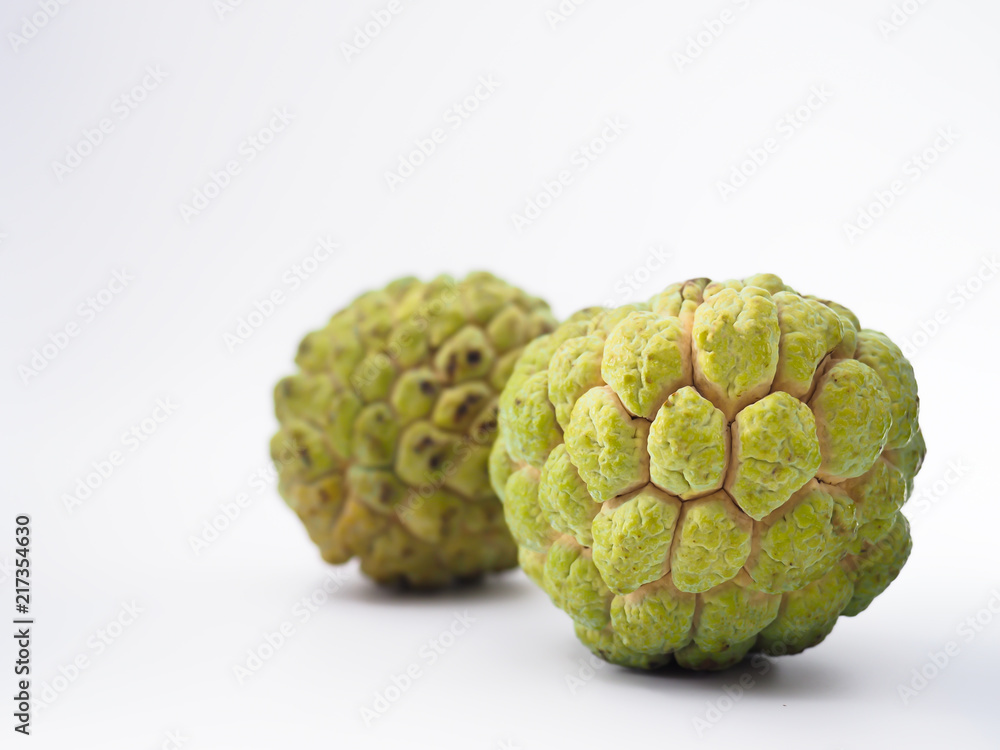 Two isolated custard apples on white background Two isolated custard apples on white background