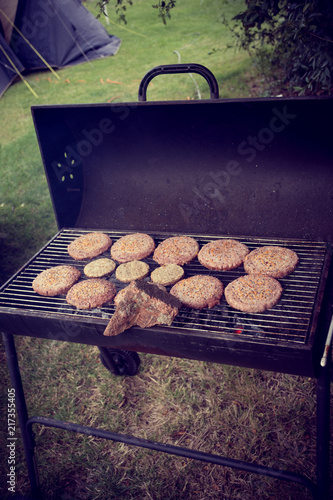 Food cooks on a grill in a campng trip photo