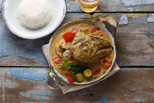 Curry fish head, Traditional singaporean cuisine photo