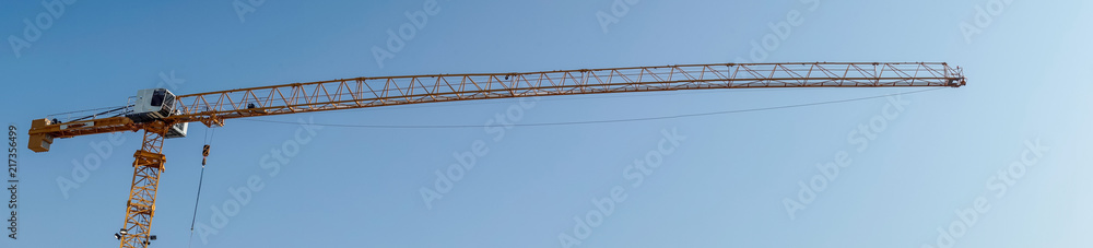 Construction Crane and Clear Blue Sky Construction Crane and Clear Blue Sky