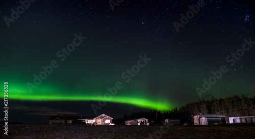 Northern Lights with a isolated house in the foreground