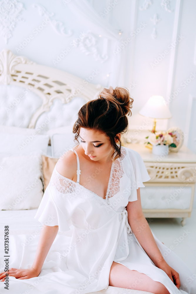 Beautiful young bride in honeymoon suite getting ready Beautiful young bride in honeymoon suite getting ready