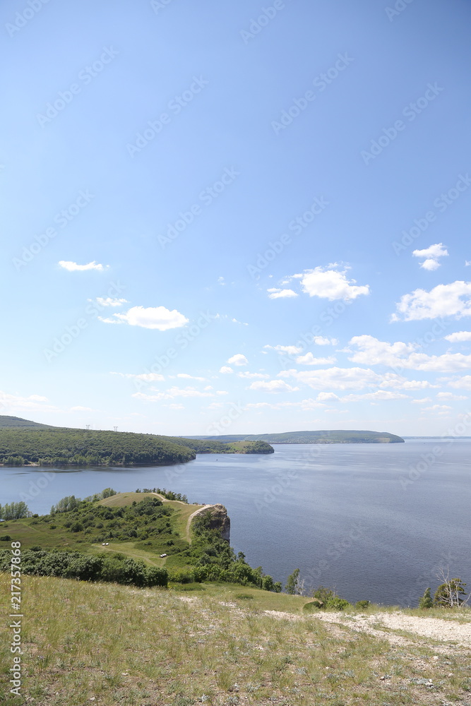 Zakharov Festival, Russia, Molodetsky Kurgan, Zhigulevskoe Sea, on the bank of the Volga River. Landscape of the rock, hilly terrain with people.
