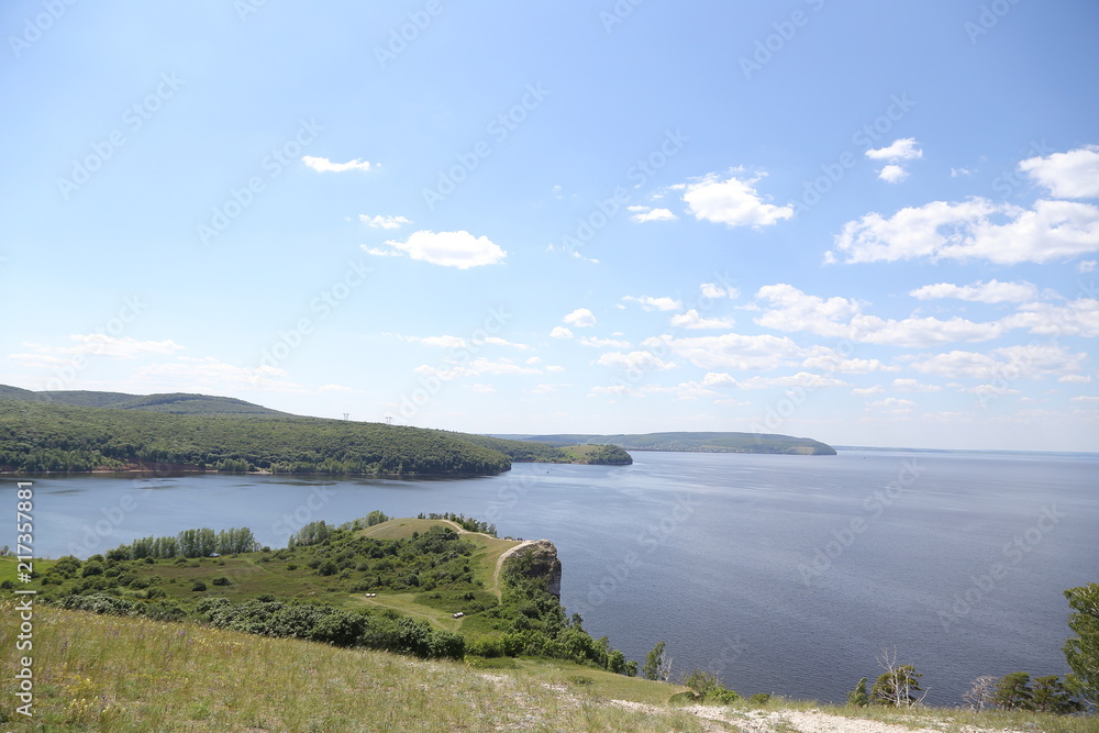 Zakharov Festival, Russia, Molodetsky Kurgan, Zhigulevskoe Sea, on the bank of the Volga River. Landscape of the rock, hilly terrain with people.