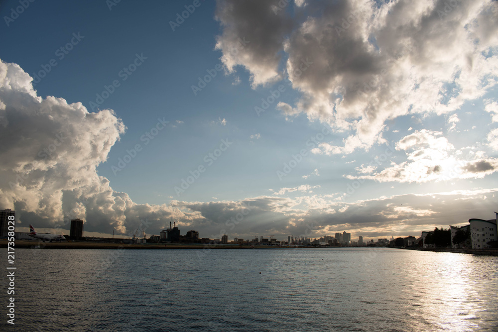 Beautiful sunset above the River Themes in London with a clouds coming from storm Derby. Beautiful sunset above the River Themes in London with a clouds coming from storm Derby.