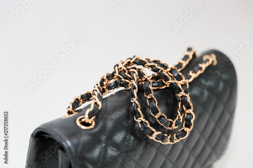 Photo of black leather bag  on white background. photo