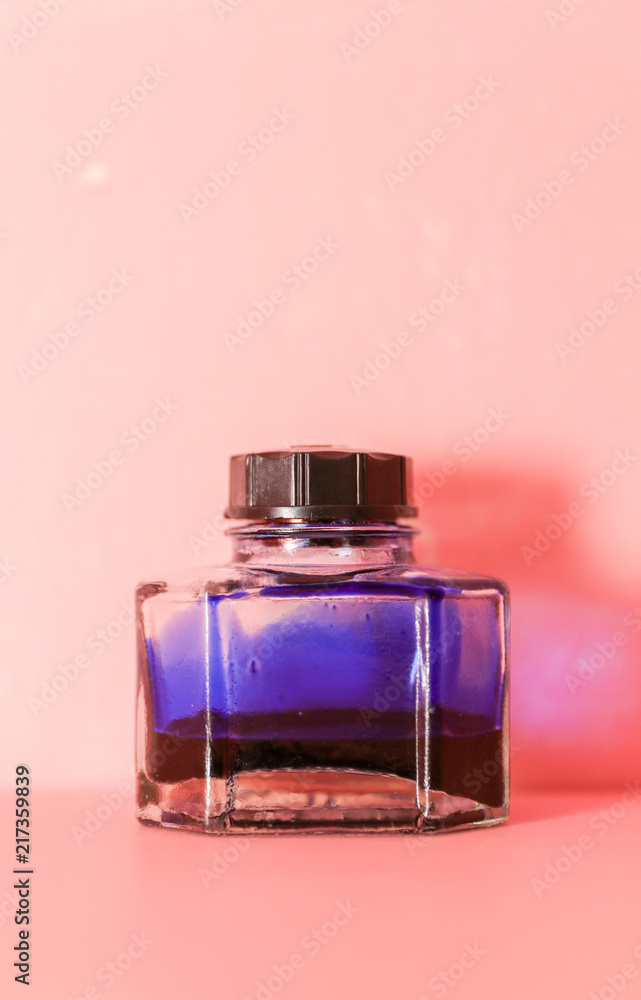 Inkwell on the pink background.close up. Inkwell on the pink background.close up.