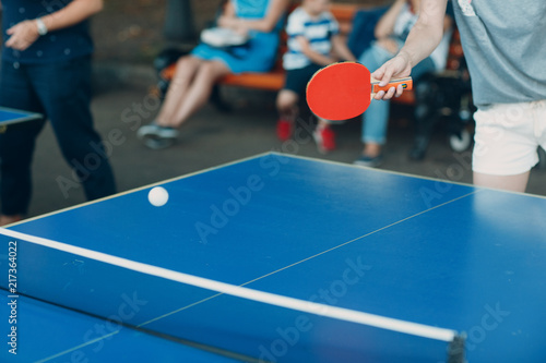 Table for ping pong and player with racket