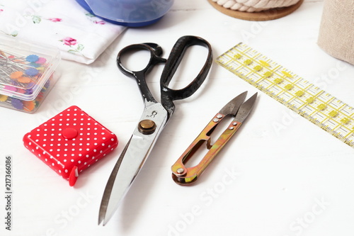 Sewing and crafts tools - scissors, measuring tape, pins, rope, cutter, ruler...