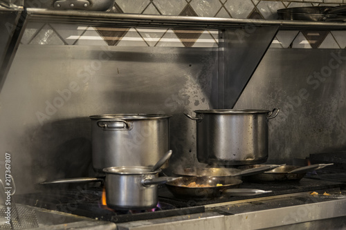 Pans on gas cooker in a international food restaurant