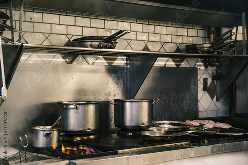 fish on plate and stove running full steam