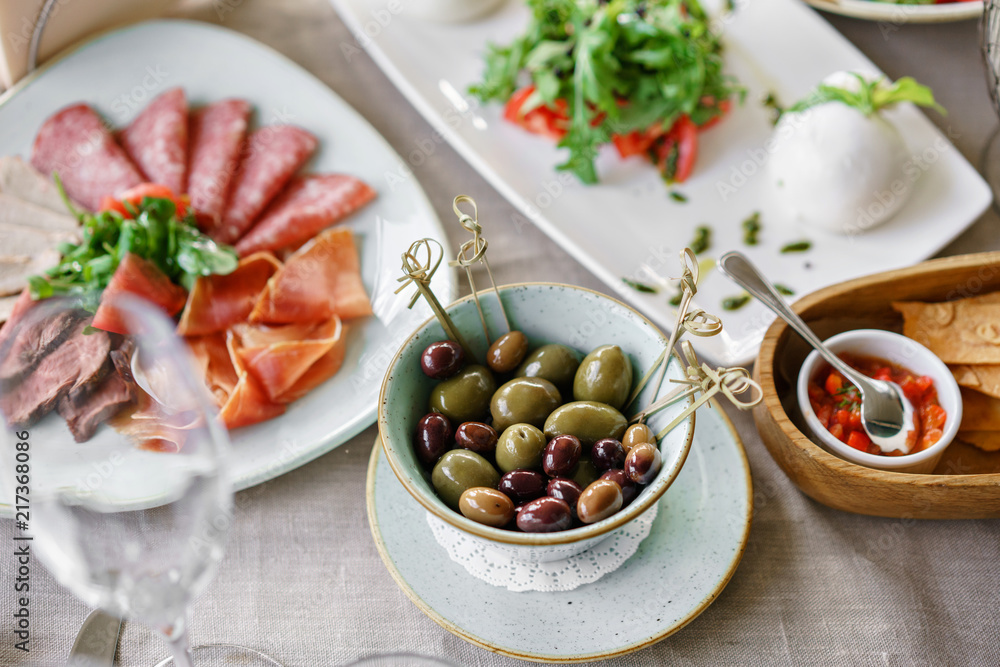 Different meals for the guests on Banquet table. delicious dishes on the table in the restaurant. serving table for birthday or wedding. Different meals for the guests on Banquet table. delicious dishes on the table in the restaurant. serving table for birthday or wedding.