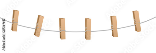 Six clothes pins on a clothes line rope - wooden pegs holding nothing.