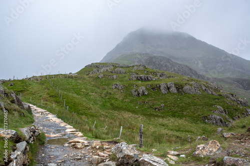 PYG track hiking route up to foggy Snowdon mountain summit on overcast day in summer - 1 photo