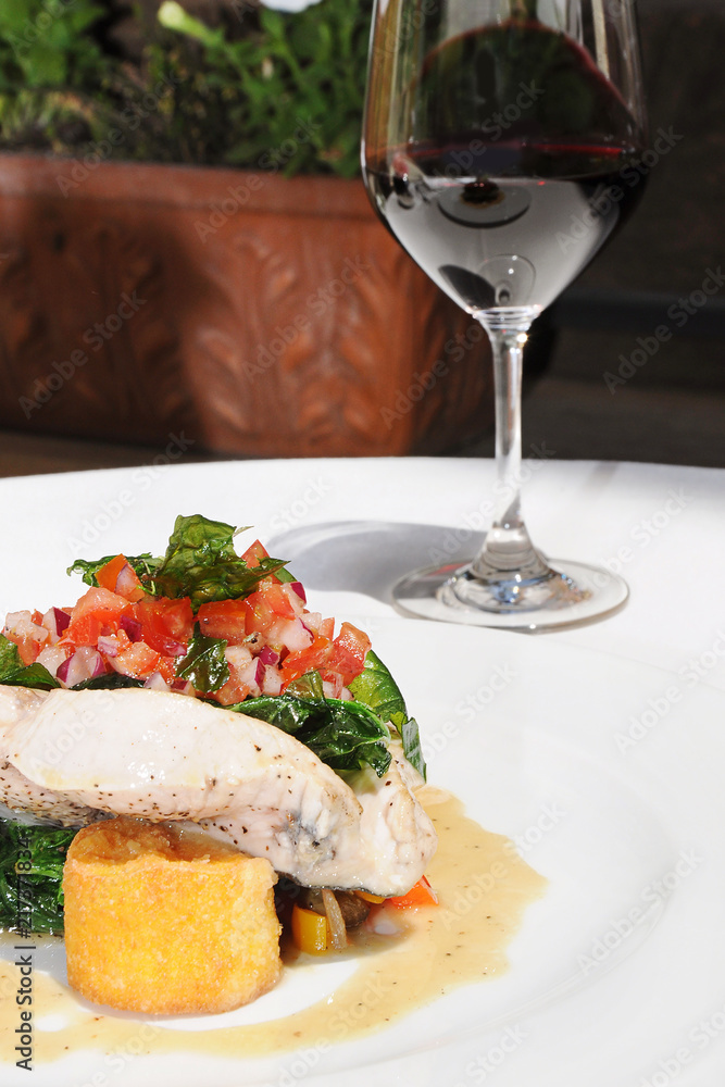 Delicious dinner with Fish and red wine Delicious dinner with Fish and red wine