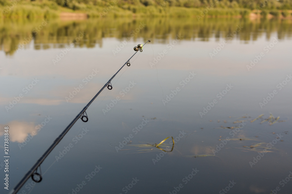 To fish with a fishing rod on the lake
