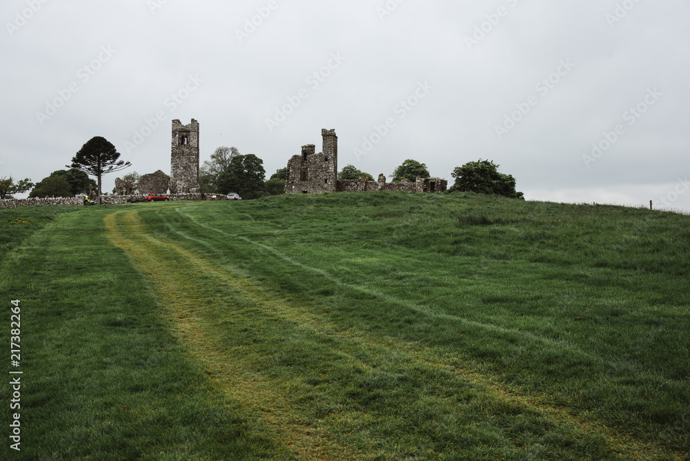 Old Stone Castle on a Green Grass Hill, Ireland Old Stone Castle on a Green Grass Hill, Ireland