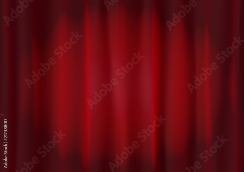 Background image of red velvet stage curtain with spot lighting. Abstract red vertical lines and strips.