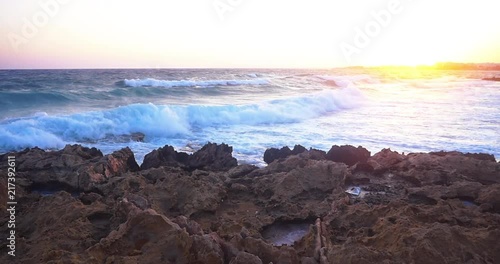 Waves crashing by the sea at Zypern, Greece, Slow Motion shot photo