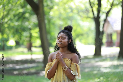 Fotografie Upset woman giving pleading worship