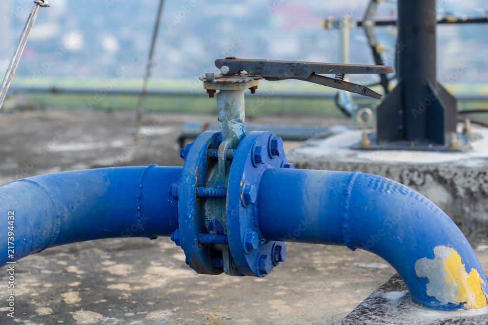 closeup blue pipe for cooling system on rooftop building closeup blue pipe for cooling system on rooftop building