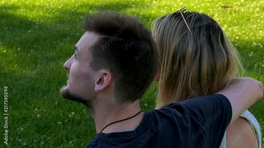 Couple sitting and chatting in a Park in Vienna Couple sitting and chatting in a Park in Vienna