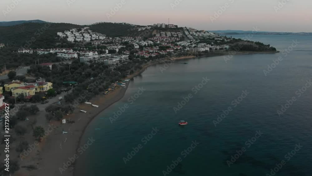 Summer houses by the sea in small coastal town at sunset, Aegean Sea (4K aerial) Summer houses by the sea in small coastal town at sunset, Aegean Sea (4K aerial)