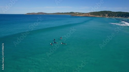 4k Drone footage of surfers at a beautiful Australian coastal beach landscape. photo