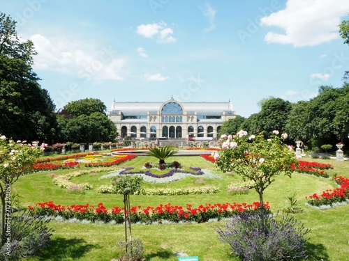 Canvas Print Botanical garden Flora in Cologne on a a sunny summer day with coloured flowers and blue sky in the background, a beautiful place for a visit