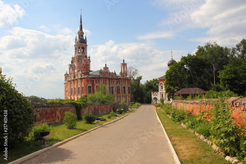 Russia, Mozhaisk Kremlin, region landmark on a summer day against the blue sky with clouds – medieval architecture, old buildings, view from main entrance