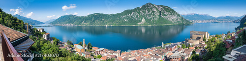 Lake Lugano. Panoramic view of Campione d'Italia, famous for its casino. In the background on the right the city of Lugano, in the middle Monte San Salvatore, on the left Melide and Monte San Giorgio photo