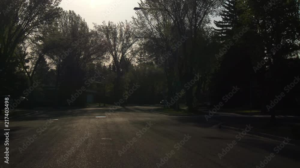 Early morning sun shines on a quiet city street. Early morning sun shines on a quiet city street.
