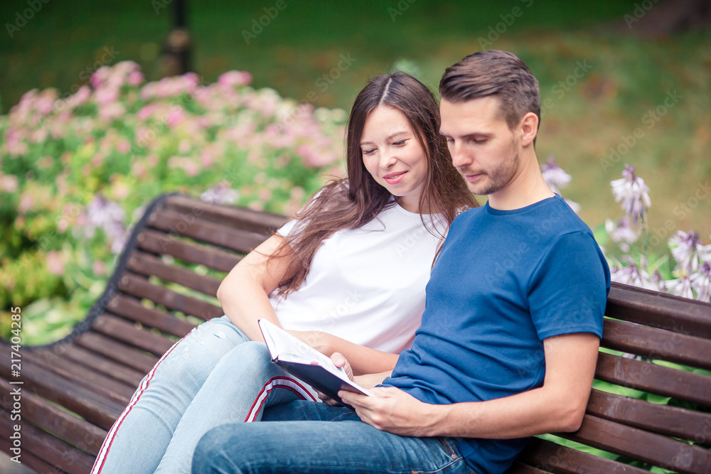 Couple reading books in the park Couple reading books in the park