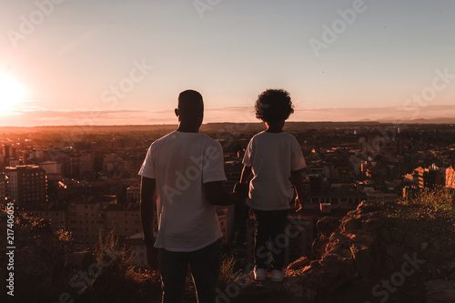 Rear view of father and son looking at view 