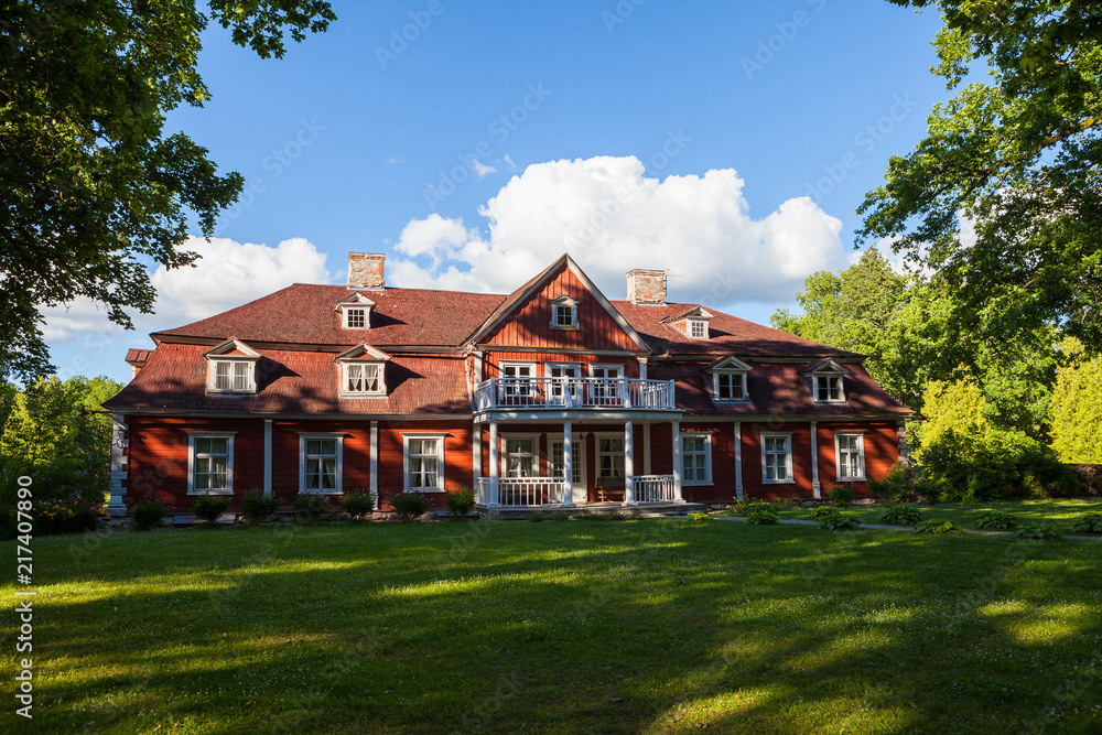 Old big wooden house in the park. Traditional scandinavian styled vintage living place.